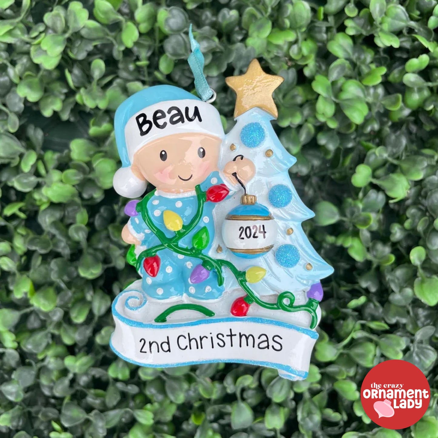 Baby Decorating the Tree Blue Ornament