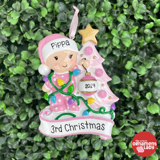 Baby Decorating the Tree Pink Ornament